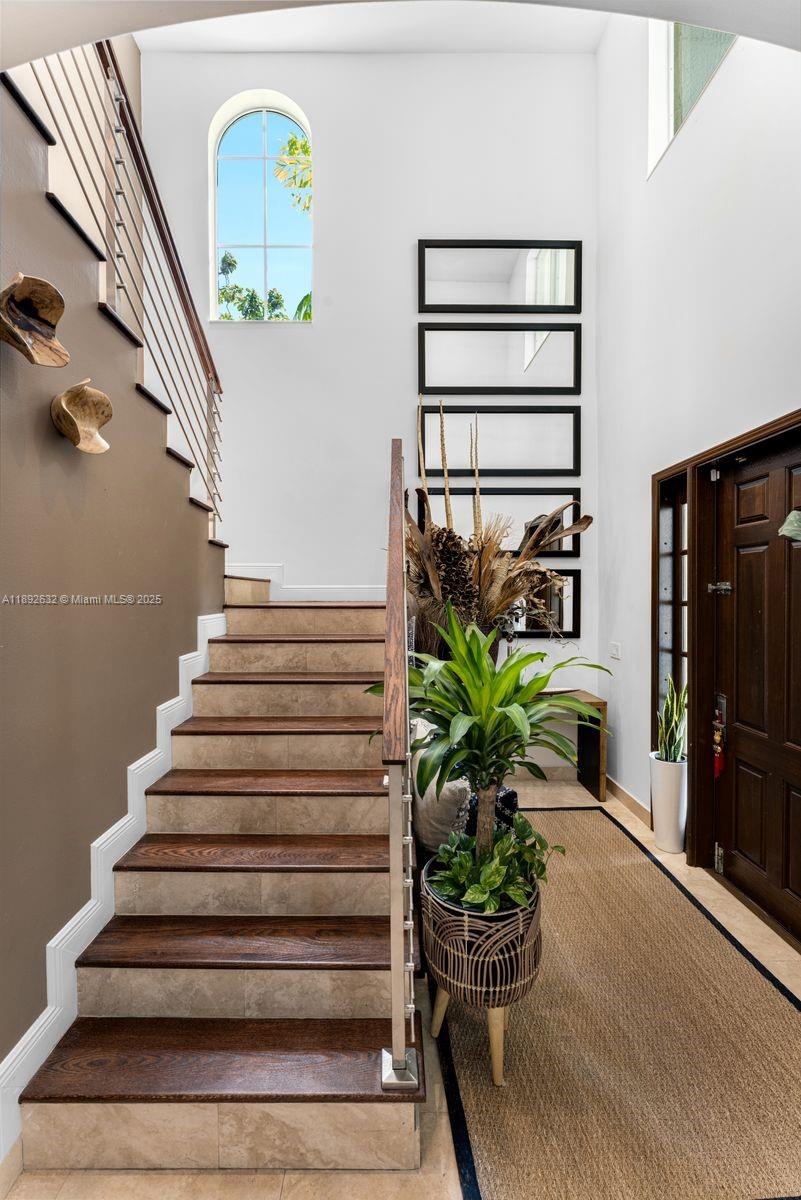 2143 North Bay Road Miami Beach, FL 33140 - Photo 21 of 39 a vase of flowers sitting on a floor in front of a house