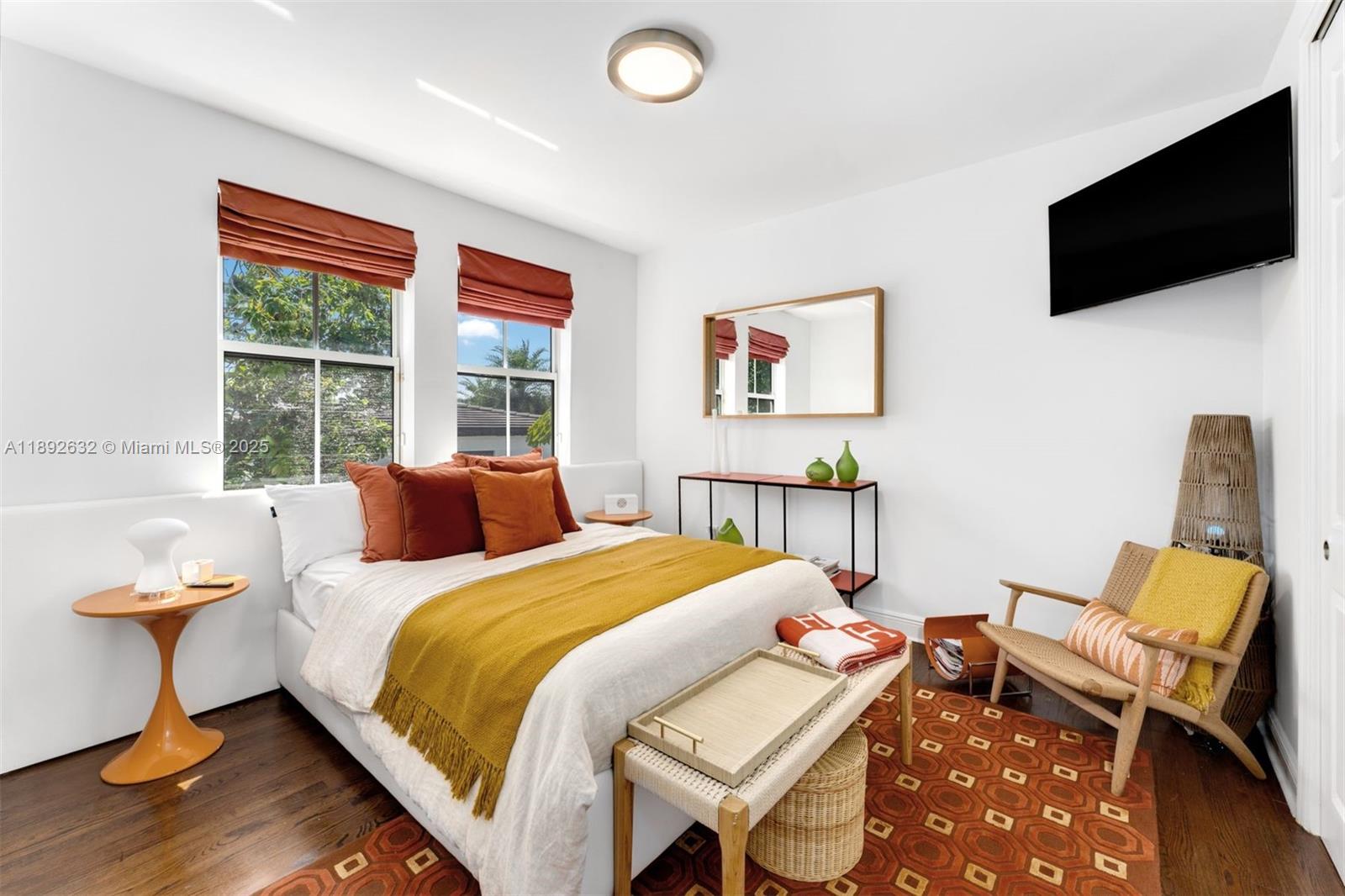 2143 North Bay Road Miami Beach, FL 33140 - Photo 31 of 39 a bedroom with a bed and a television