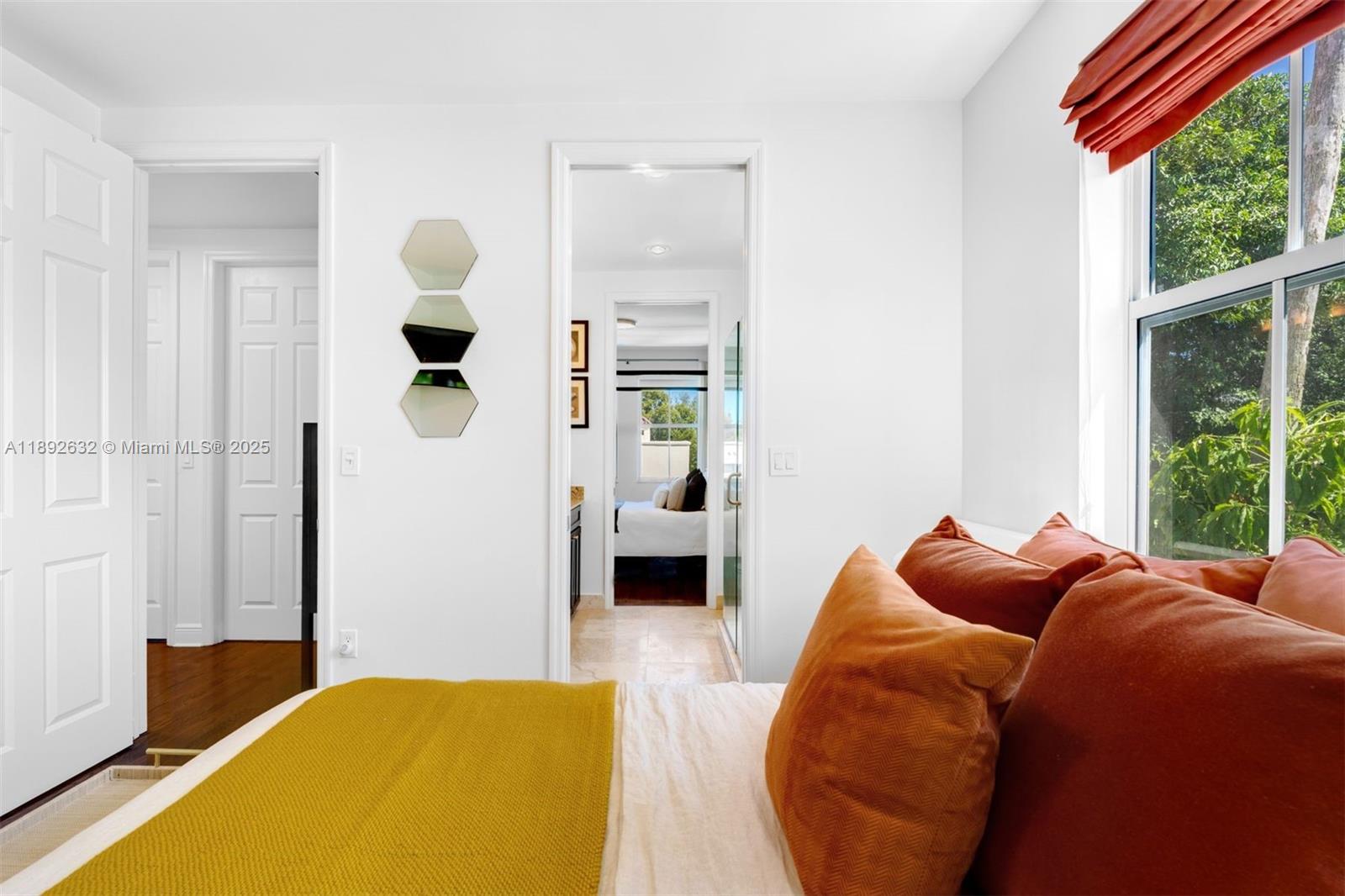 2143 North Bay Road Miami Beach, FL 33140 - Photo 32 of 39 a bedroom with a bed and a large window