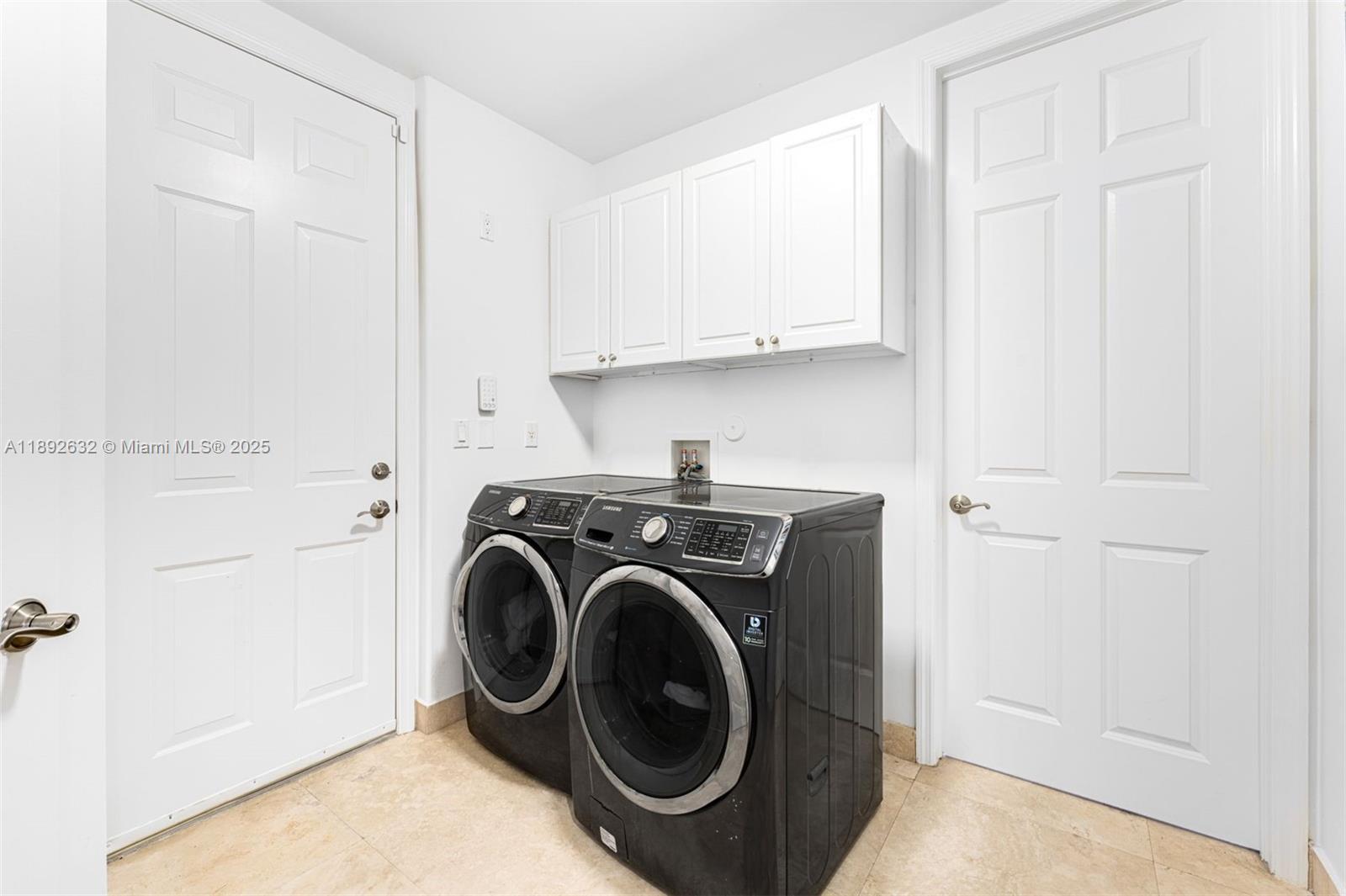 2143 North Bay Road Miami Beach, FL 33140 - Photo 38 of 39 a utility room with dryer and washer
