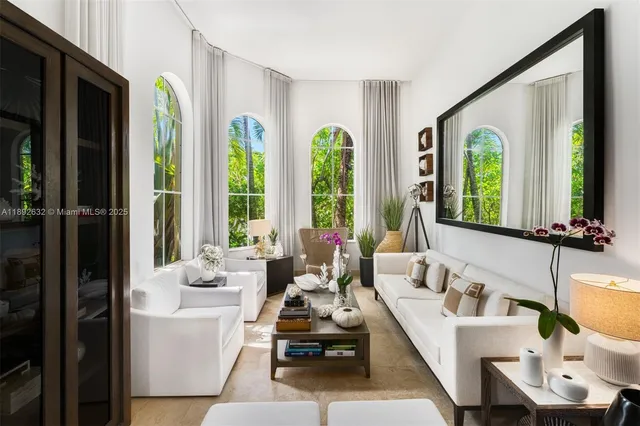 a view of living room with furniture and a chandelier