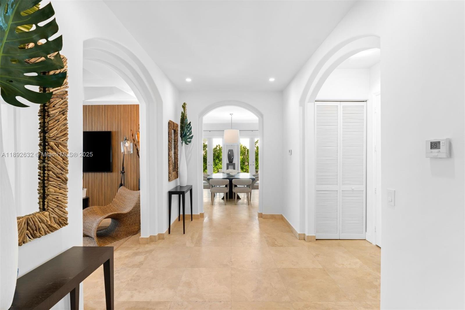 2143 North Bay Road Miami Beach, FL 33140 - Photo 8 of 39 a view of living room with furniture and a chandelier