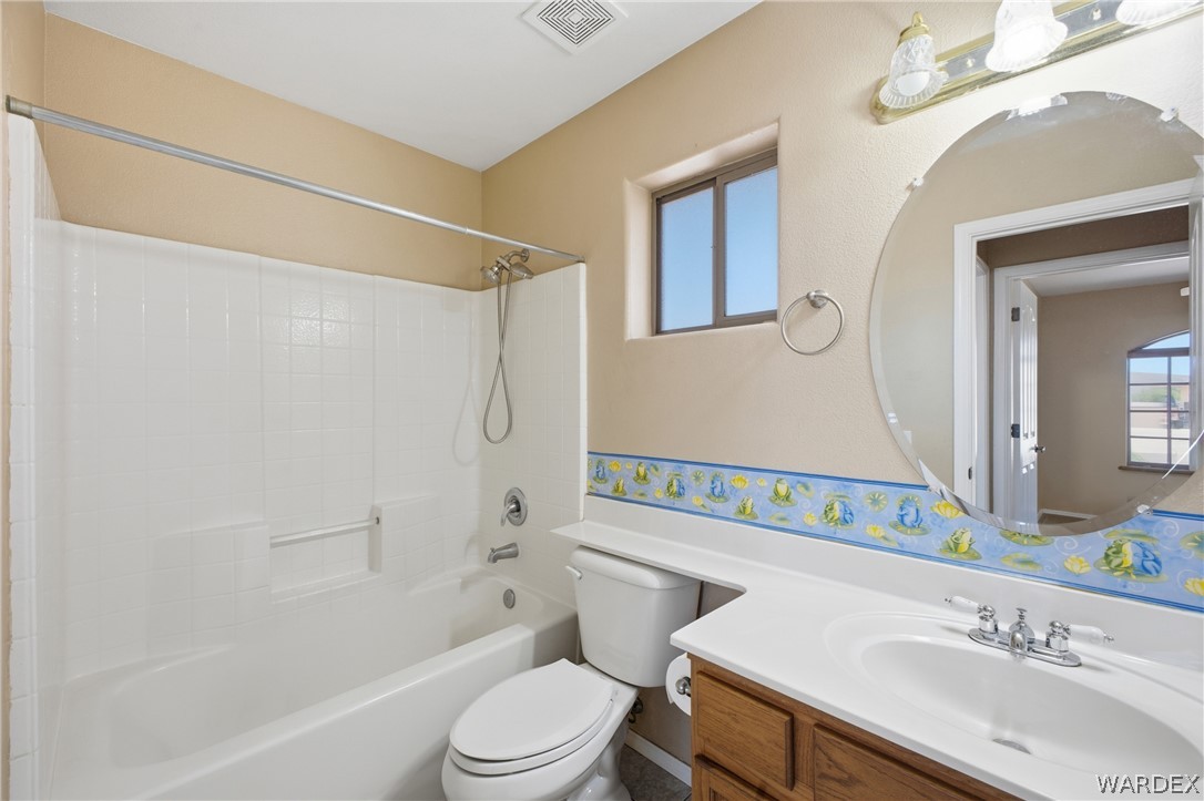 3918 North Eagle Rock Road Kingman, AZ 86409 - Photo 18 of 44 a bathroom with a sink a toilet and shower