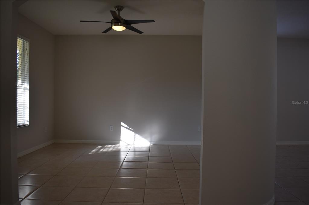 15509 Montilla Loop Tampa, FL 33625 - Photo 8 of 20 a view of an empty room with ceiling fan and window