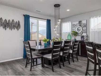 a view of a dining room with furniture window and outside view