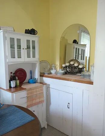 a view of living room with furniture and wooden floor
