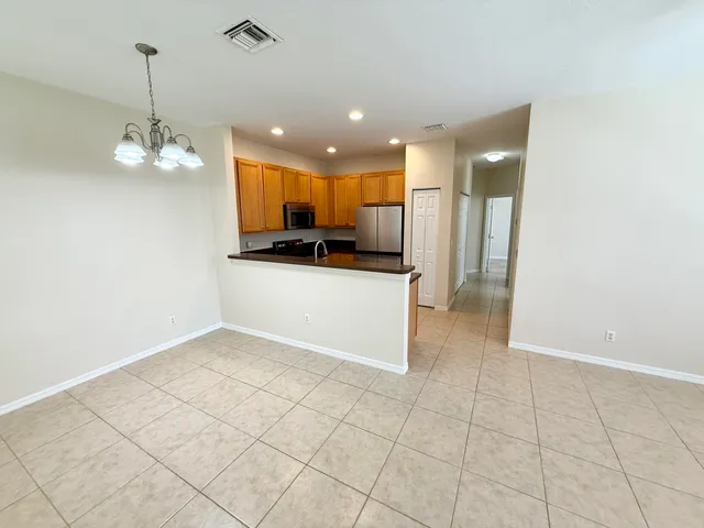 $245,000 | 3051 Southeast Lexington Lakes Drive, Unit 202, Stuart, FL 34994