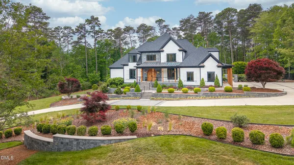 a front view of a house with swimming pool