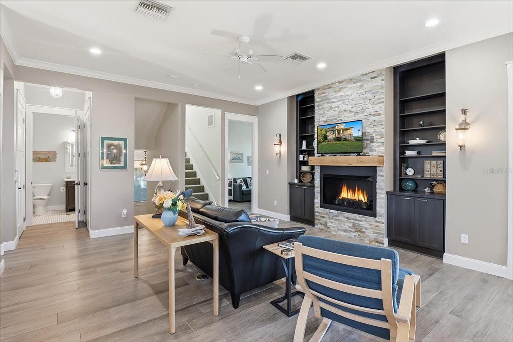 14211 West St Martins Road Crystal River, FL 34429 - Photo 11 of 60 a living room with furniture a fireplace and a flat screen tv