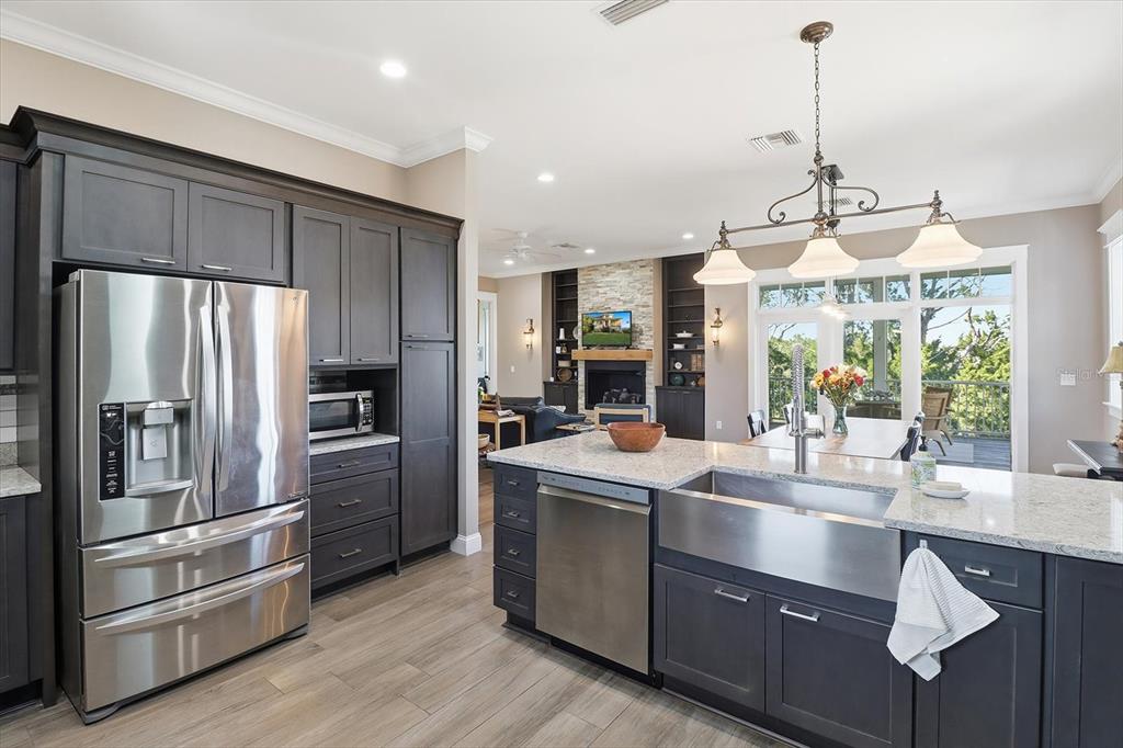 14211 West St Martins Road Crystal River, FL 34429 - Photo 15 of 60 a kitchen with kitchen island a counter top space stainless steel appliances and cabinets
