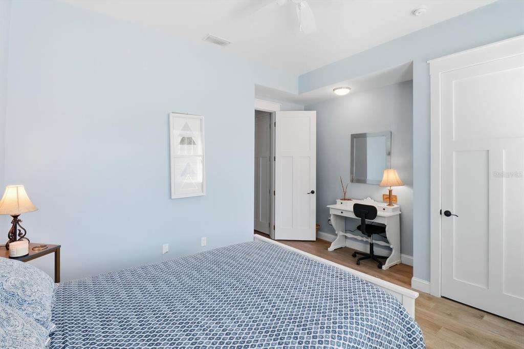 14211 West St Martins Road Crystal River, FL 34429 - Photo 23 of 60 a bedroom with a bed and wooden floor