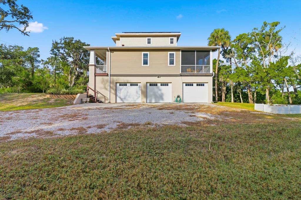 14211 West St Martins Road Crystal River, FL 34429 - Photo 40 of 60 a front view of a house with a big yard