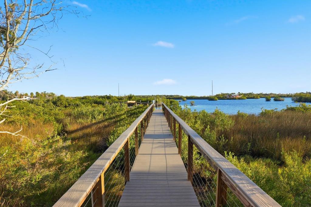 14211 West St Martins Road Crystal River, FL 34429 - Photo 42 of 60 a view of wooden floor and lake from a balcony