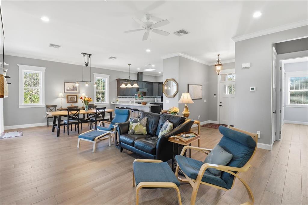 14211 West St Martins Road Crystal River, FL 34429 - Photo 10 of 60 a view of a dining room with furniture and wooden floor