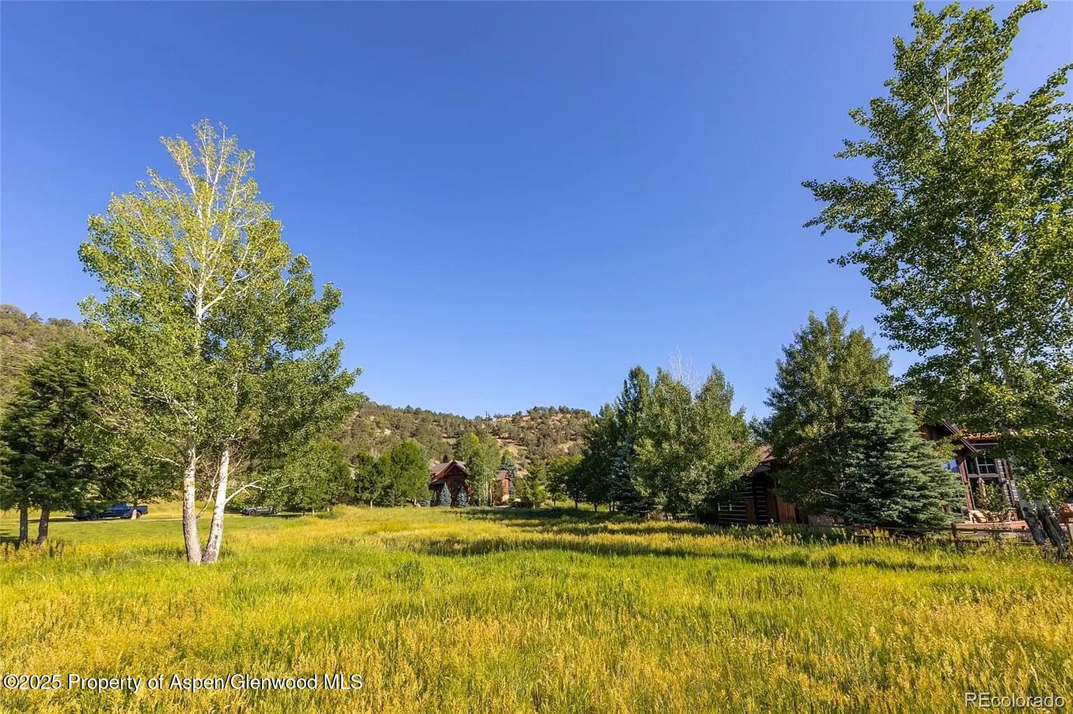 782 Perry Ridge Carbondale, CO 81623 - Photo 26 of 30 a view of a swimming pool with an outdoor space and seating area