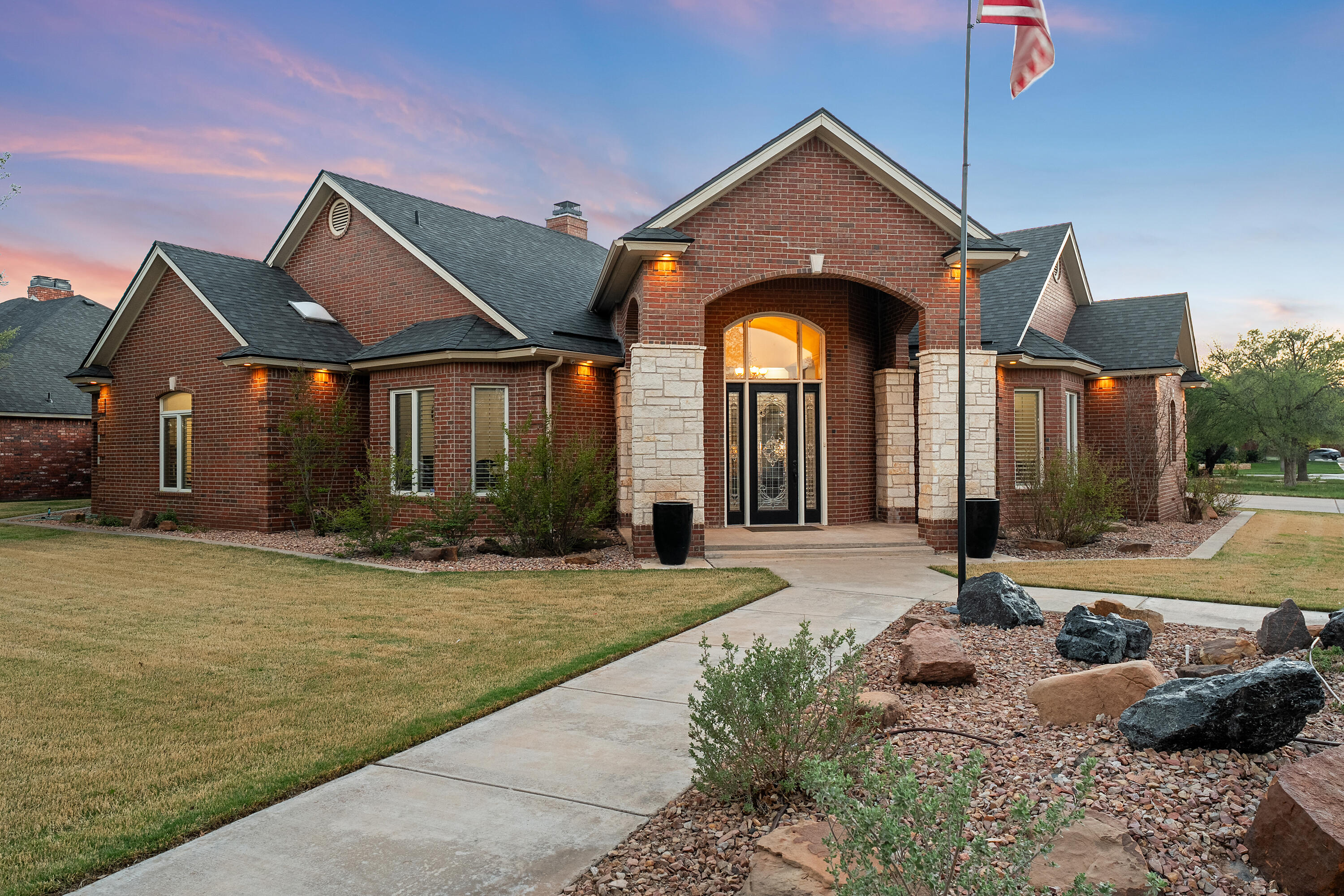 a front view of house with yard and seating area