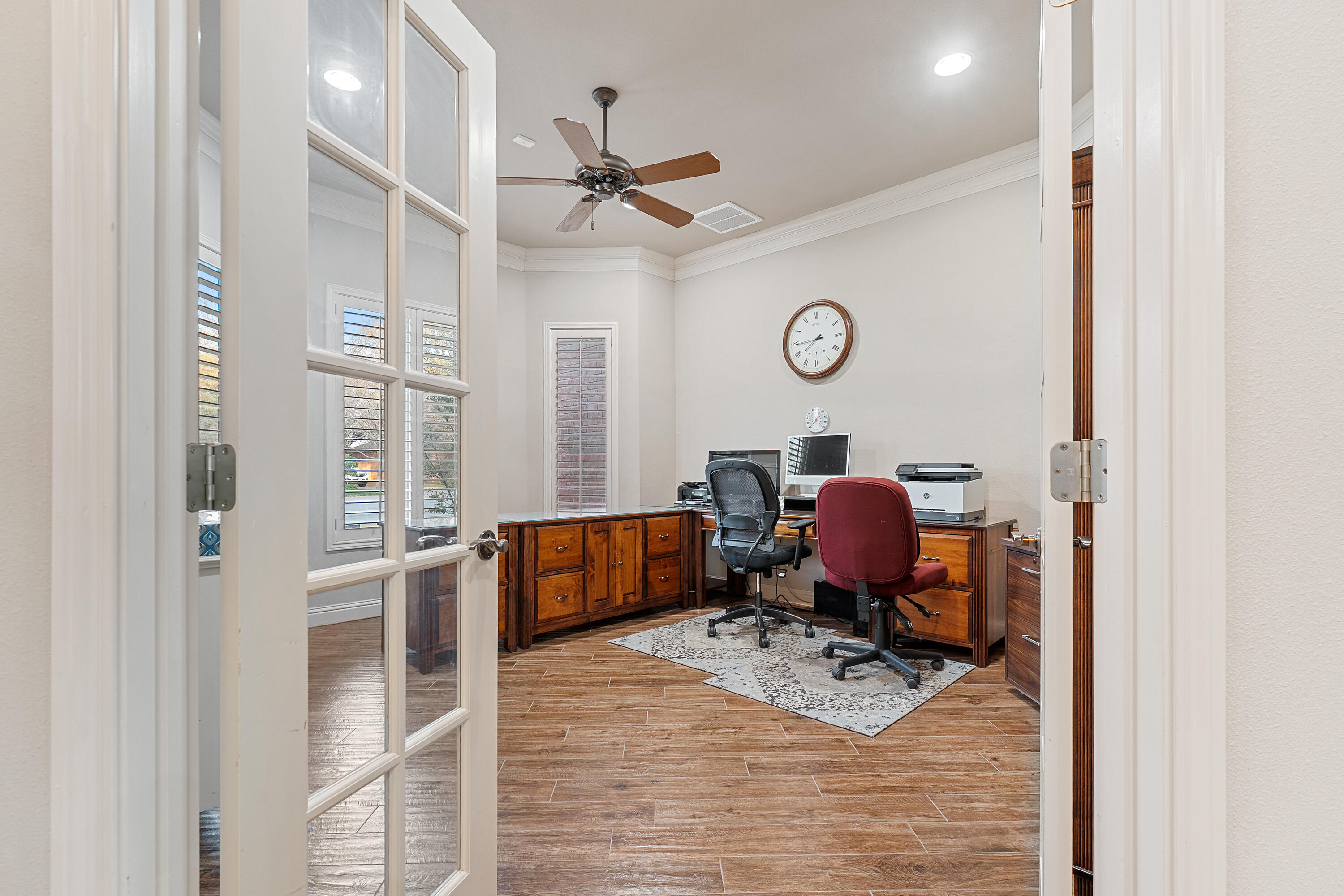 7502 Norfolk Avenue Lubbock, TX 79423 - Photo 16 of 41 a view of a workspace with furniture and a window
