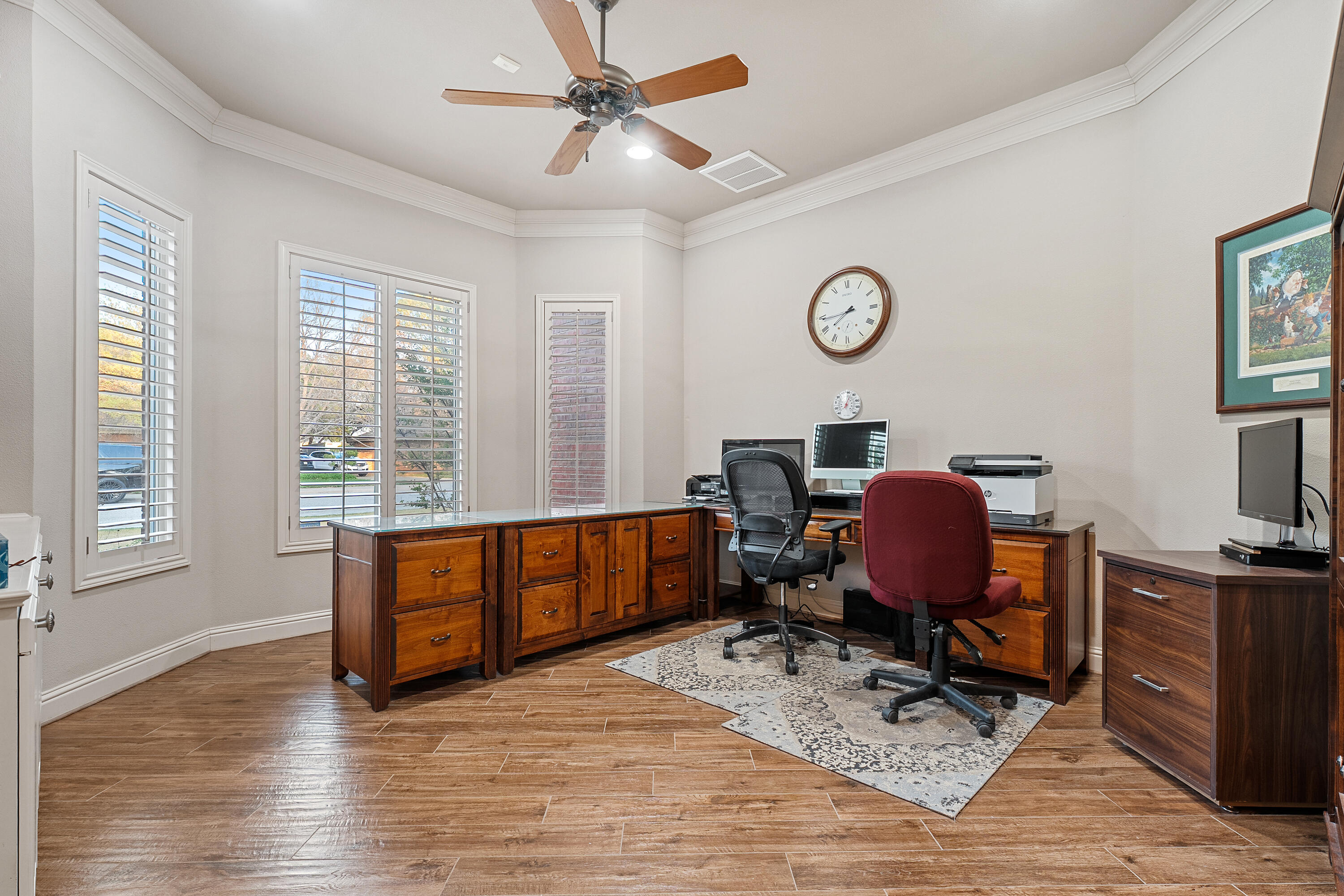 7502 Norfolk Avenue Lubbock, TX 79423 - Photo 17 of 41 a view of a workspace with furniture and a window