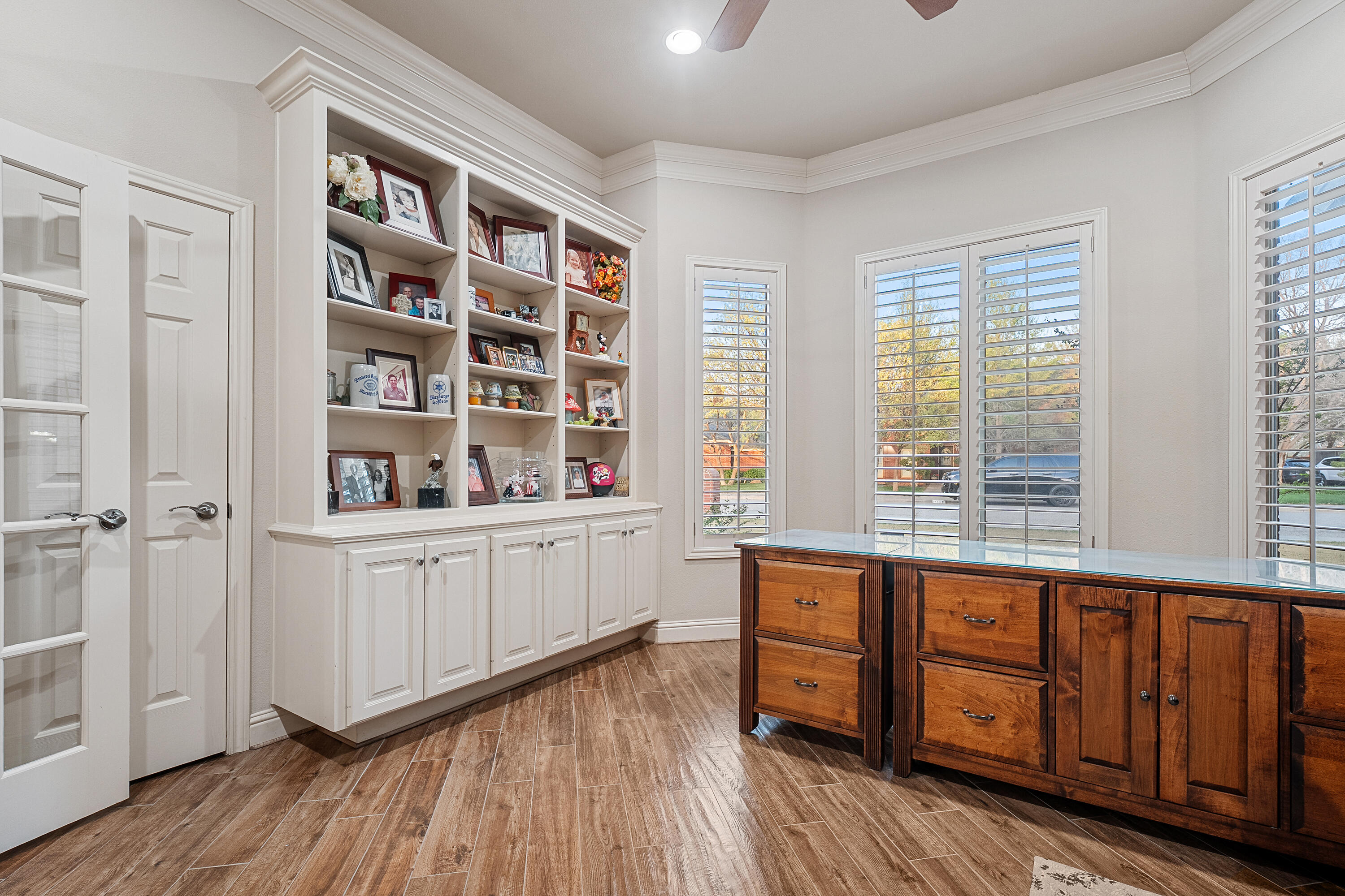 7502 Norfolk Avenue Lubbock, TX 79423 - Photo 18 of 41 a room with wooden floor and windows