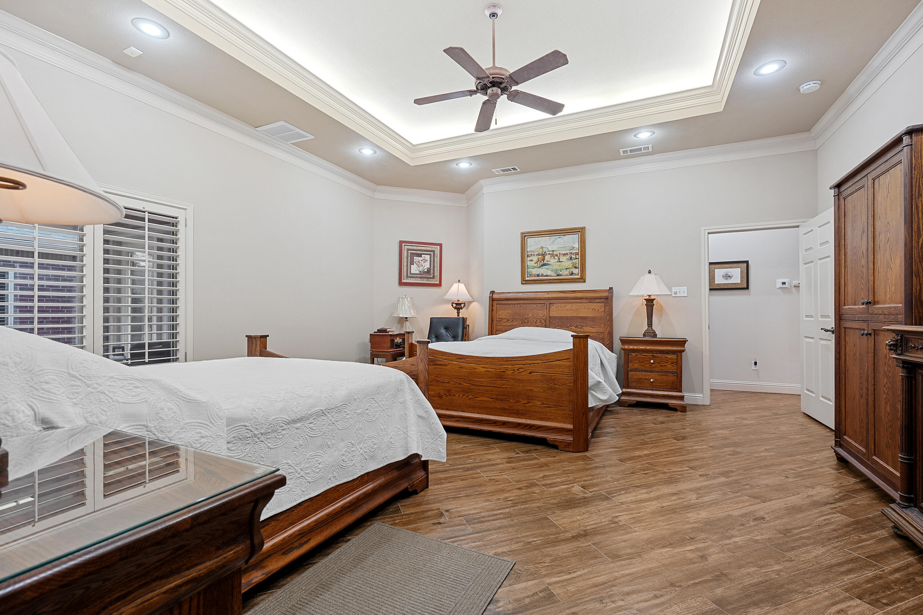 7502 Norfolk Avenue Lubbock, TX 79423 - Photo 20 of 41 a bed room with a bed and a ceiling fan