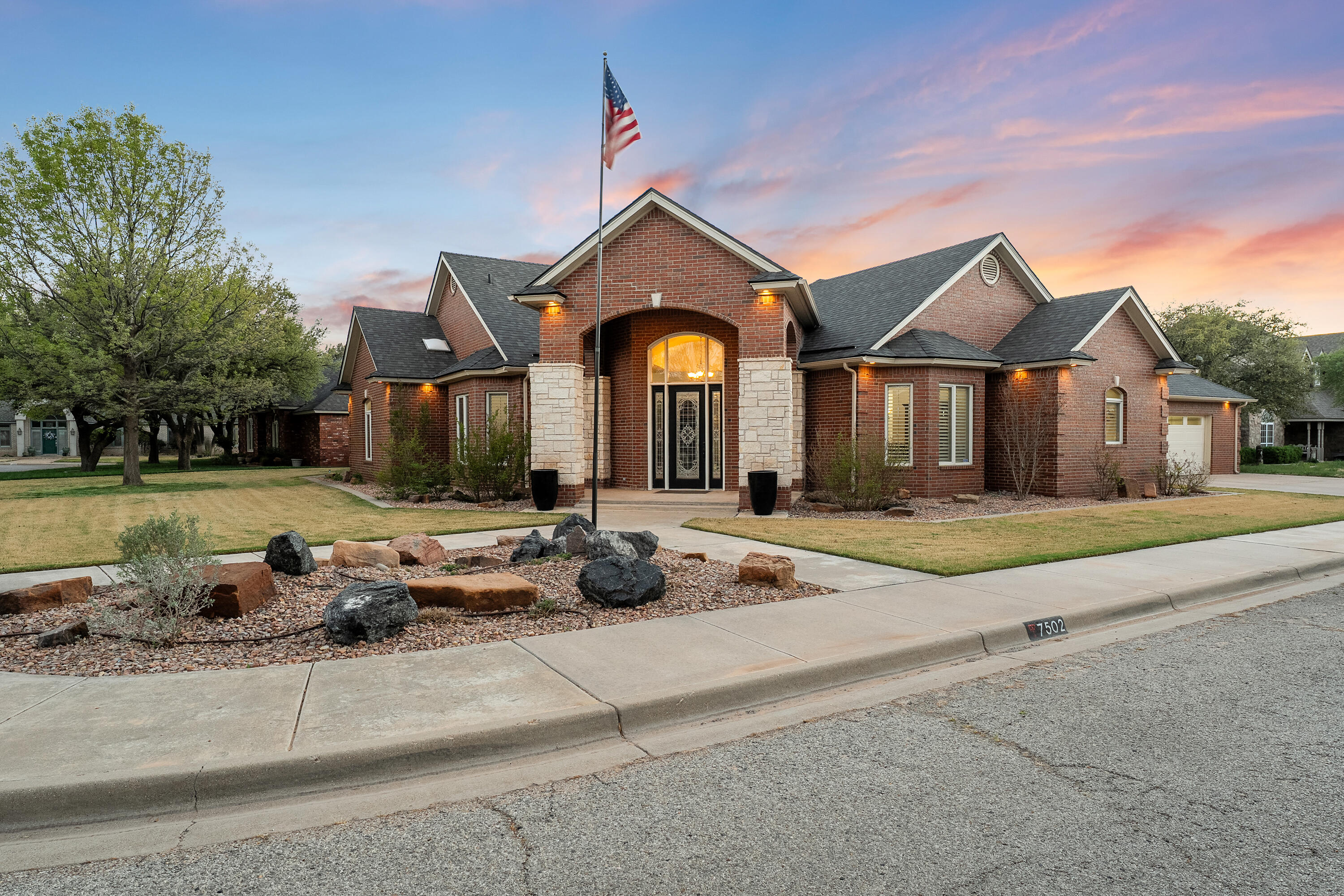 7502 Norfolk Avenue Lubbock, TX 79423 - Photo 2 of 41 a front view of a house with entertaining space