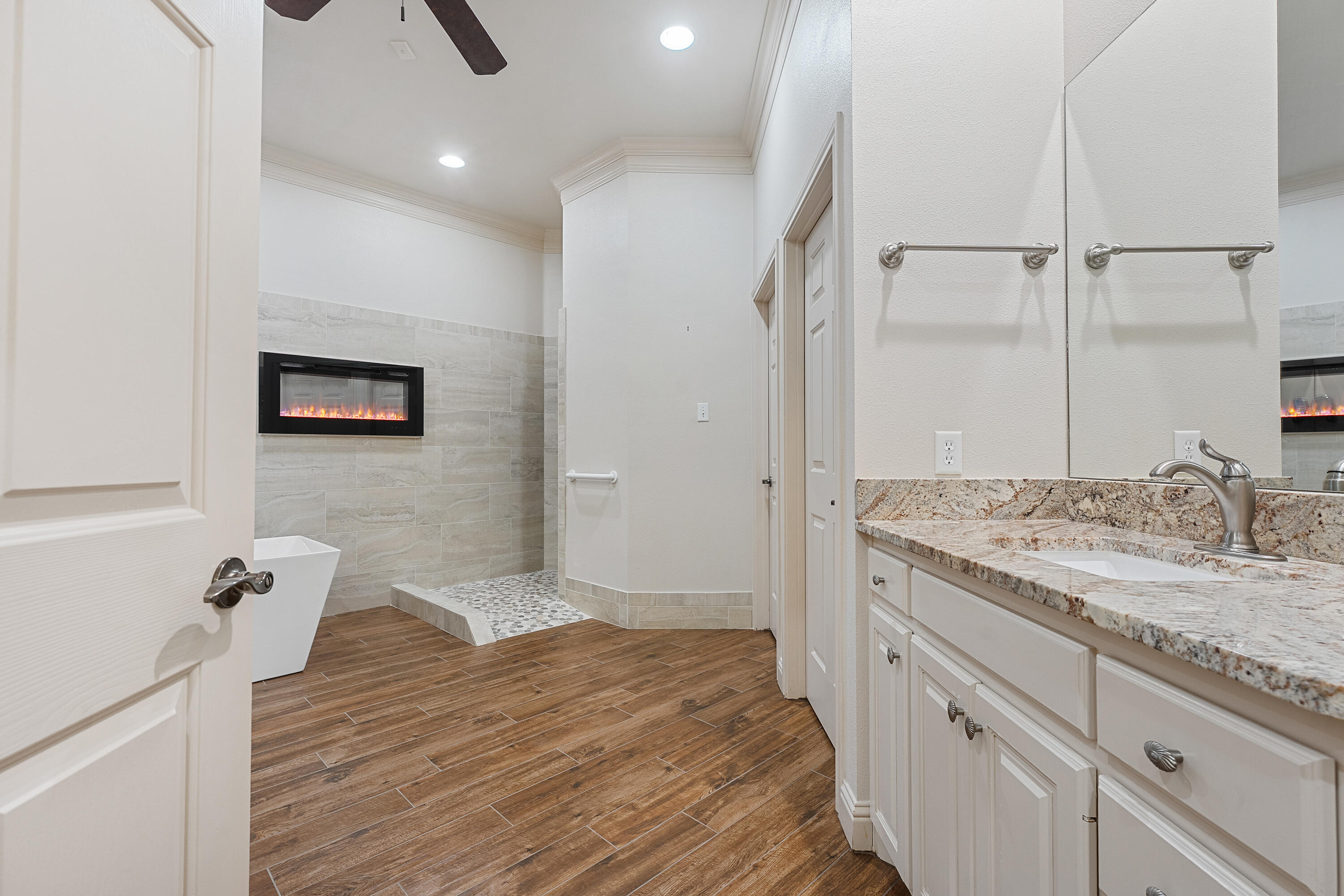 7502 Norfolk Avenue Lubbock, TX 79423 - Photo 21 of 41 a bathroom with a sink and a mirror