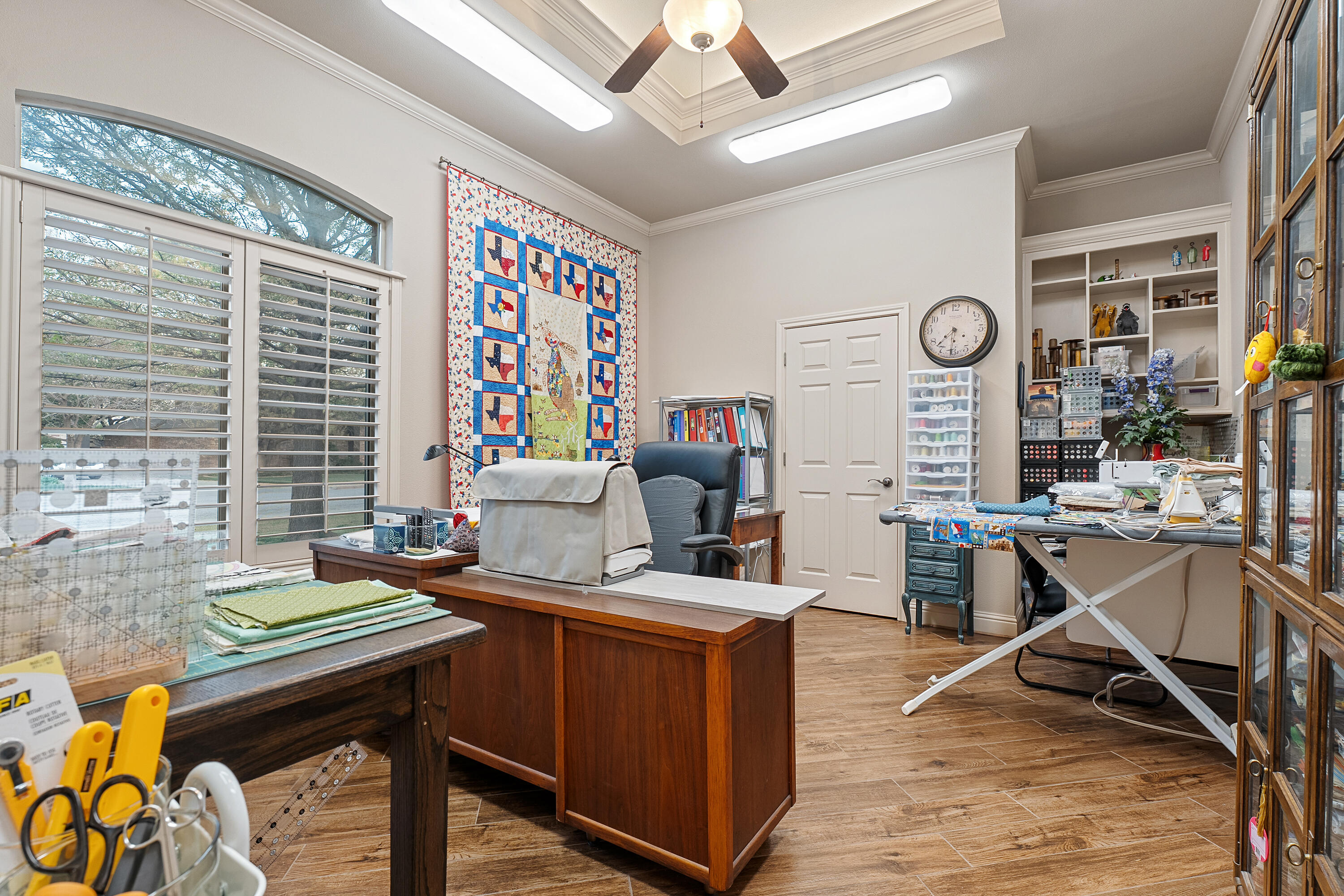 7502 Norfolk Avenue Lubbock, TX 79423 - Photo 28 of 41 a work room with furniture and a large window