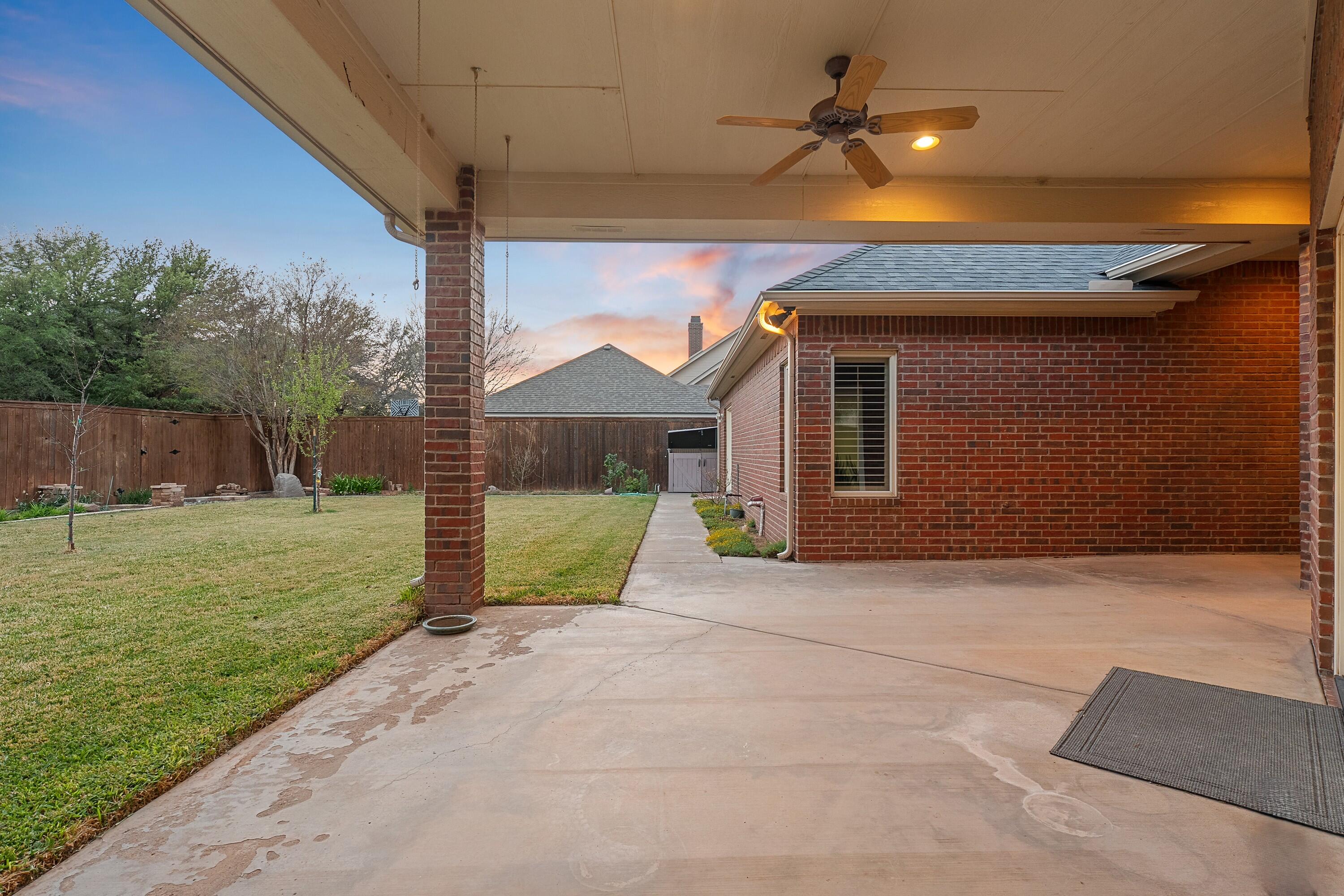 7502 Norfolk Avenue Lubbock, TX 79423 - Photo 36 of 41 a front view of a house with a yard