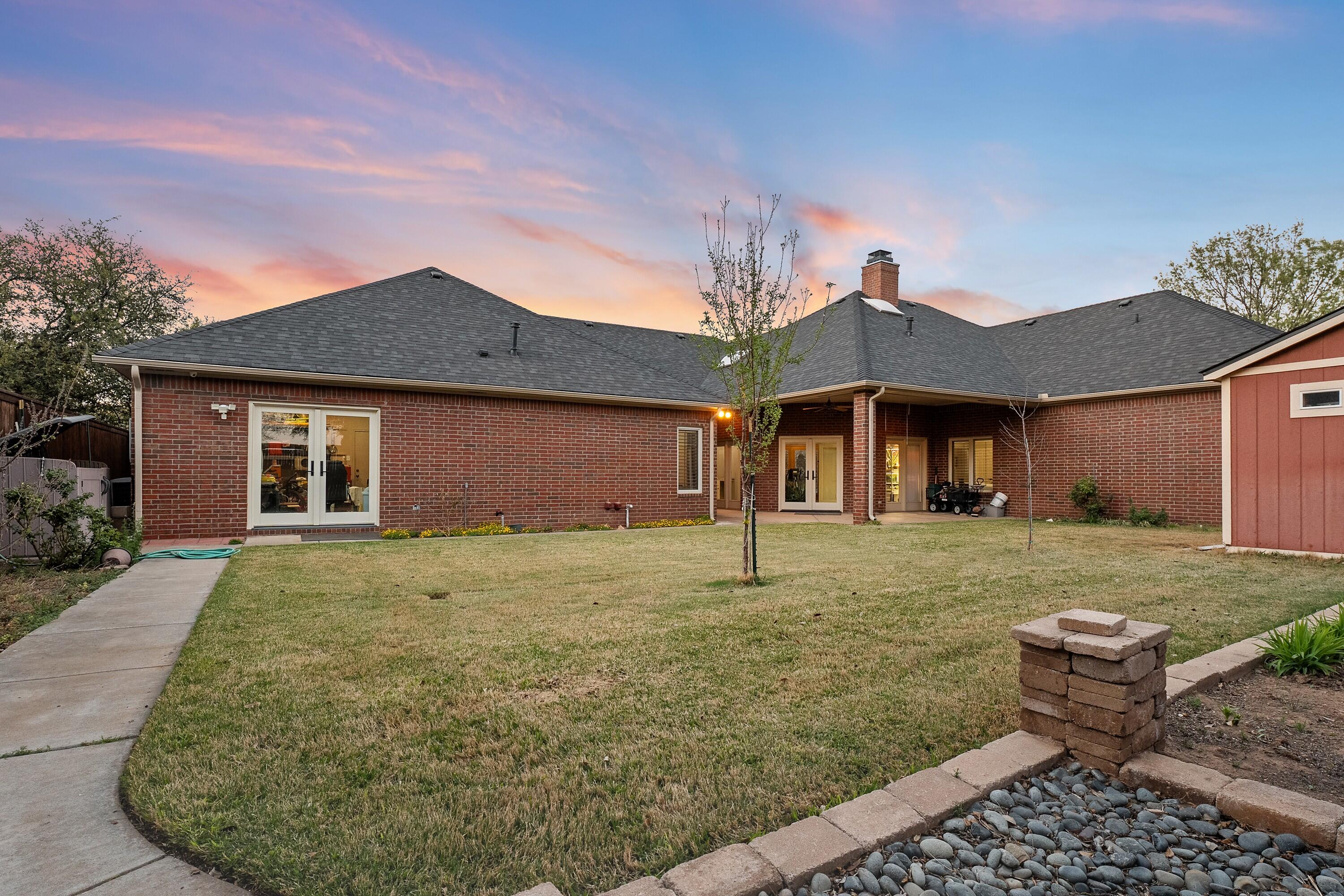 7502 Norfolk Avenue Lubbock, TX 79423 - Photo 38 of 41 a front view of a house with a yard