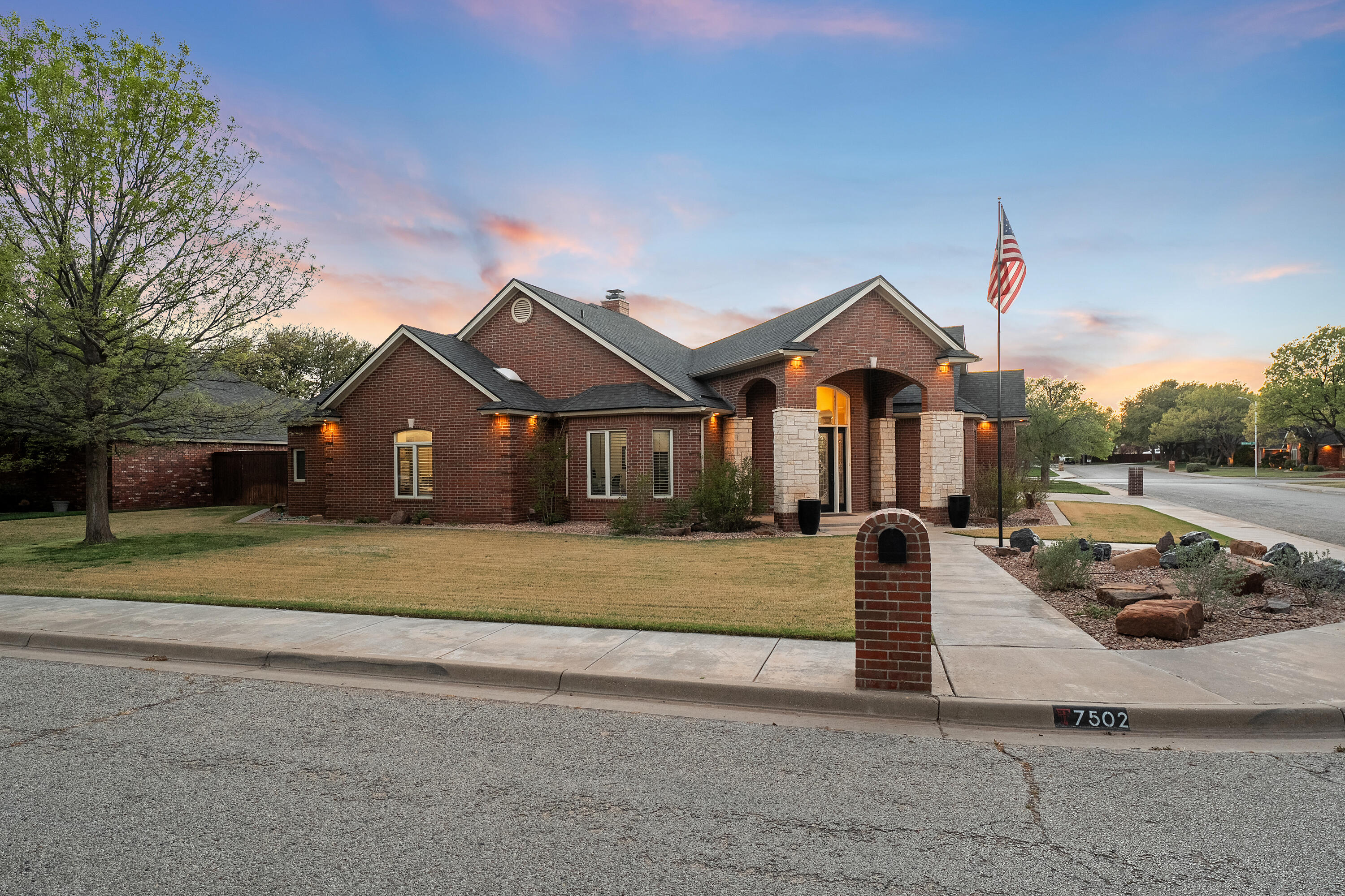 7502 Norfolk Avenue Lubbock, TX 79423 - Photo 40 of 41 a front view of a house with a yard