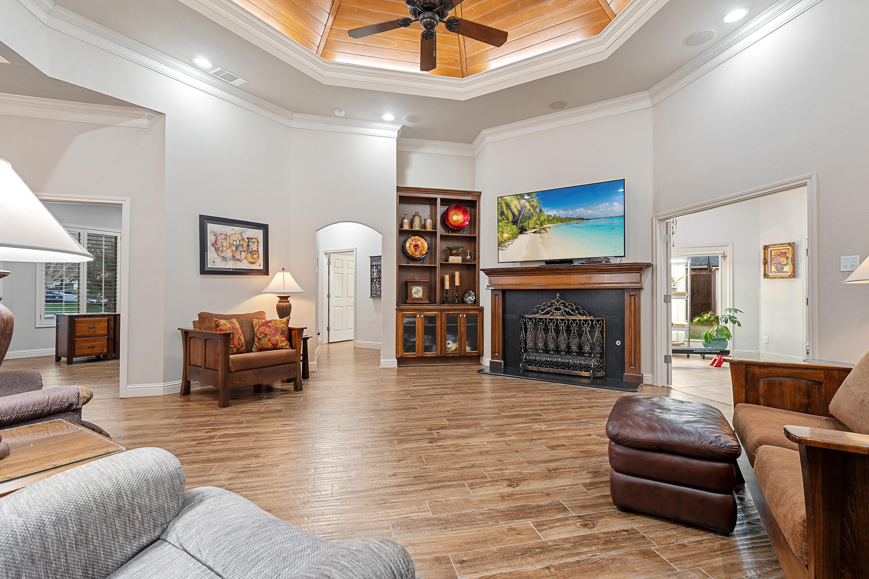 7502 Norfolk Avenue Lubbock, TX 79423 - Photo 7 of 41 a living room with furniture and a fireplace