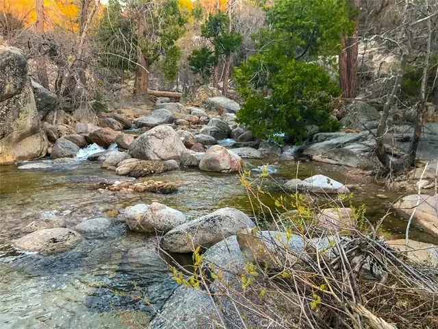 an outdoor space with patio furniture and potted plants