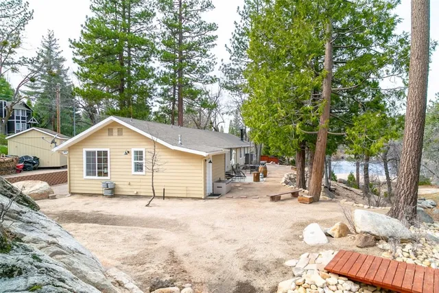 a view of a house with a tree in the background