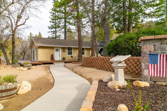 a side view of a house with a yard