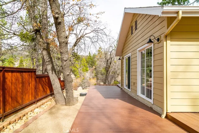 a kitchen with sink a stove and chairs