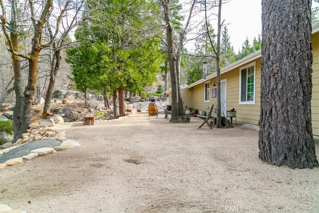 a large kitchen with a table and chairs