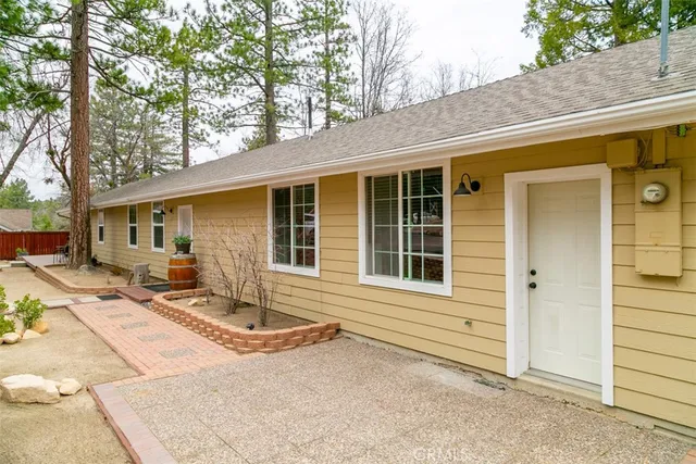 a kitchen with stainless steel appliances granite countertop a stove and white cabinets with wooden floor