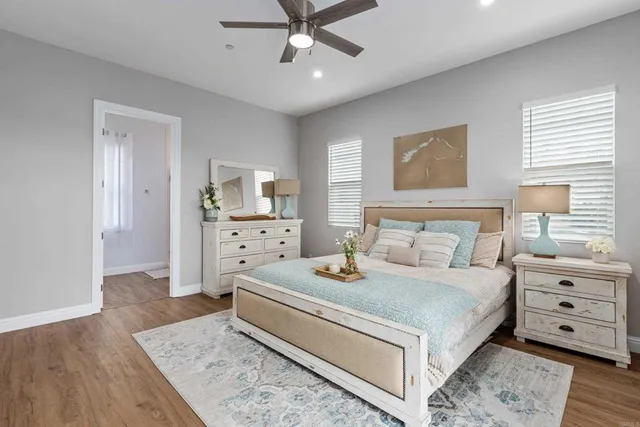 a bed room with a bed and a chandelier