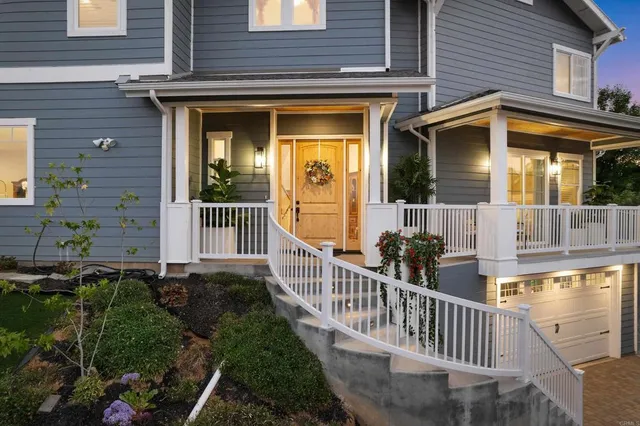 a view of a house with wooden fence