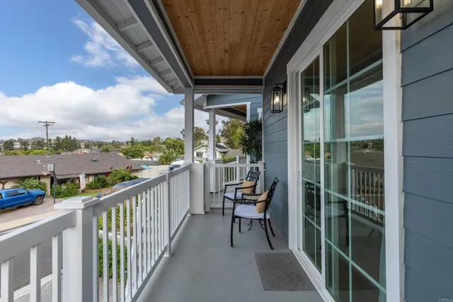 a balcony with view of city from a balcony