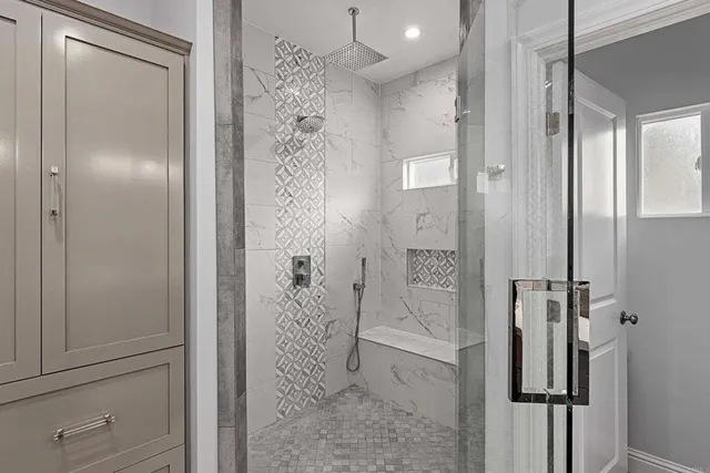 a bathroom with a shower and a sink