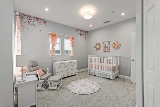 a bedroom with furniture and a window