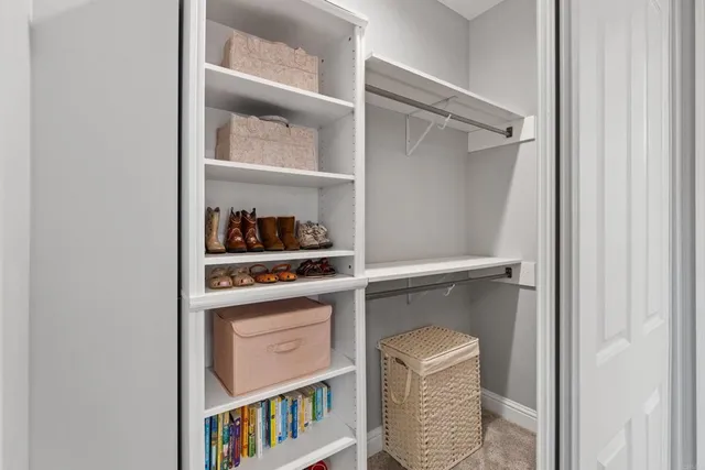 a kids room with furniture and window