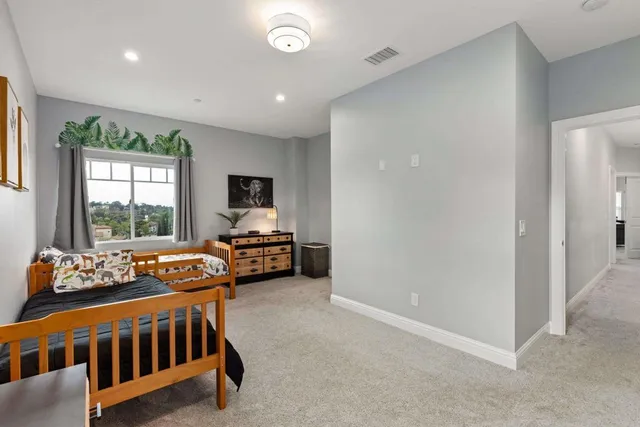 a bedroom with a bed and furniture