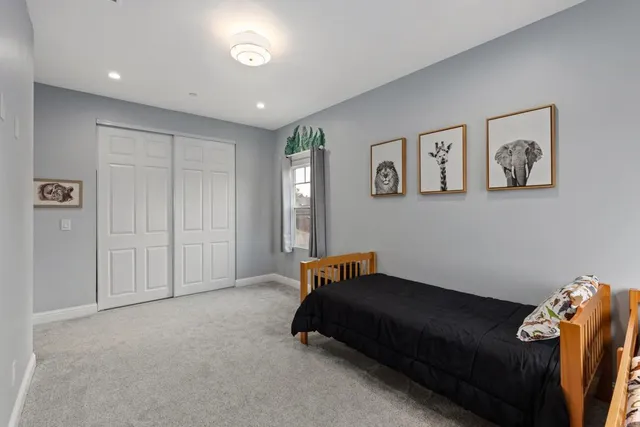 a spacious bathroom with a double vanity sink and a mirror