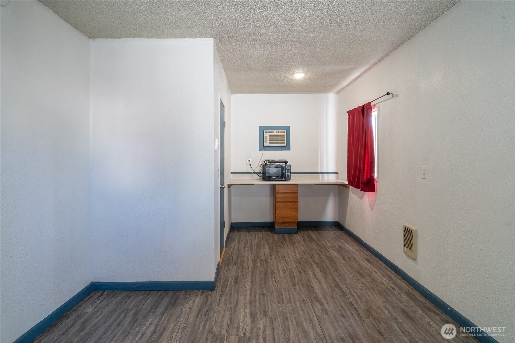 407 West 1st Avenue Ritzville, WA 99169 - Photo 12 of 26 a kitchen with a sink a refrigerator and cabinets