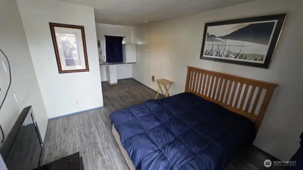 a bedroom with furniture and a window