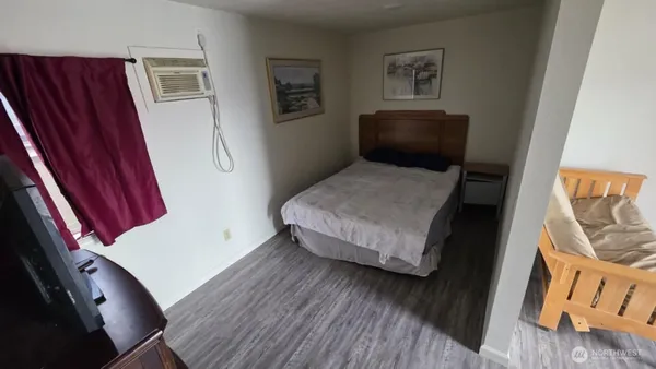 a bedroom with a bed and furniture