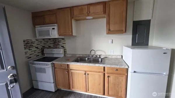 a bathroom with a sink a mirror and a toilet