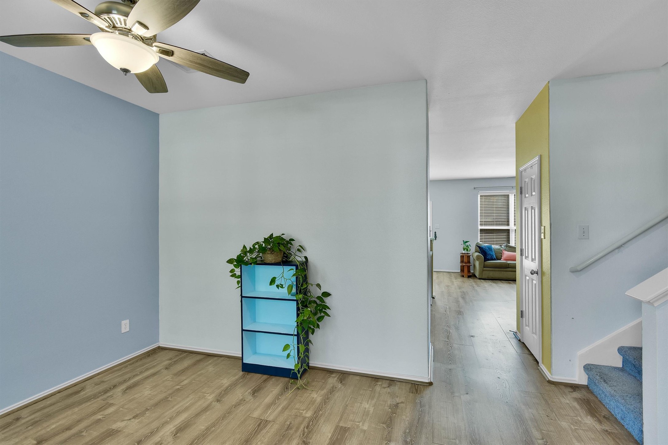 92 Verde Ranch Loop Leander, TX 78641 - Photo 5 of 37 Empty room featuring light wood finished floors and a ceiling fan
